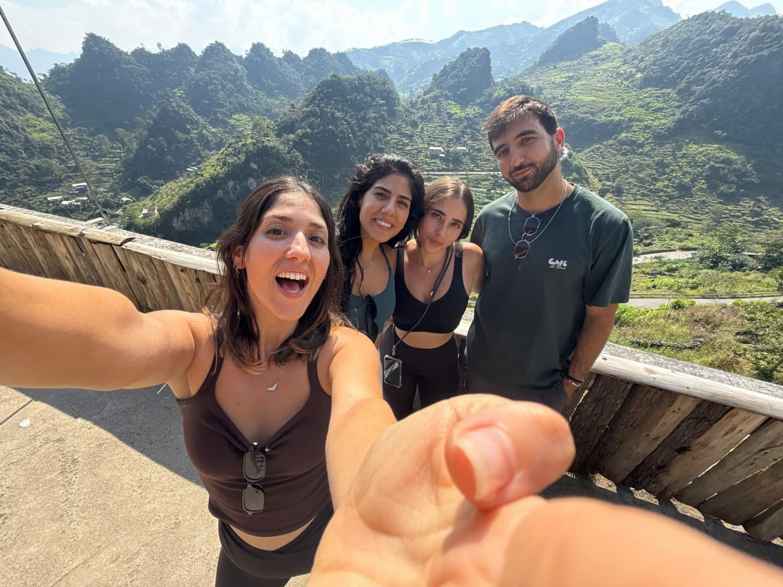 Guests taking a selfie at a mountain viewpoint